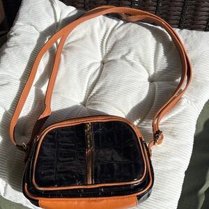 Valentina made in Italy genuine leather with three compartments.